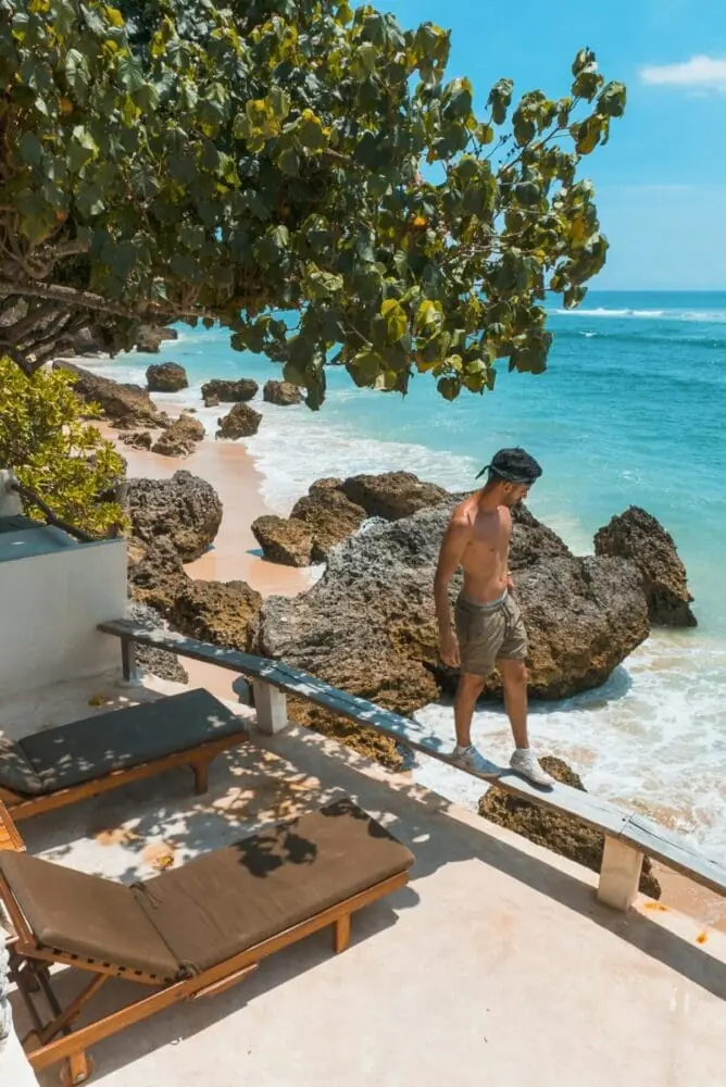 Man at a villa by the beach